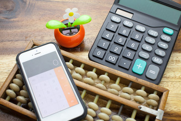 Abacus,calculator with wooden table background