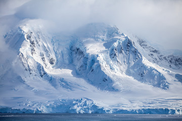 Fototapeta na wymiar Landscapes Antarctica beautiful snow-capped mountains against the cloud sky