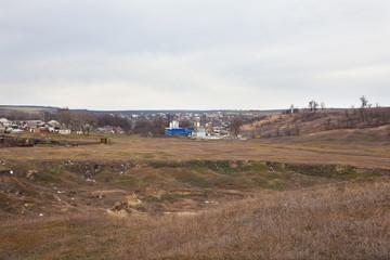 Plant in a vacant lot near the village.
