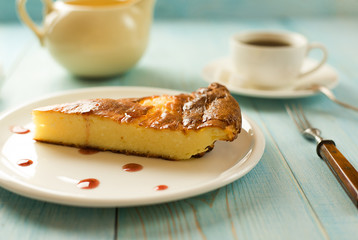 A piece of cottage cheese cake on a white plate