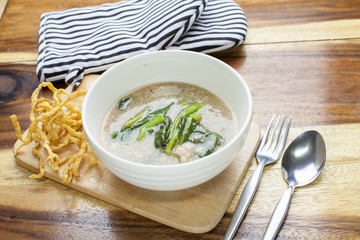 Fried noodle in Gravy on wooden background