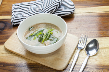 Fried noodle in Gravy on wooden background