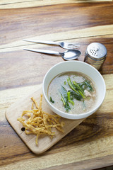 Fried noodle in Gravy on wooden background