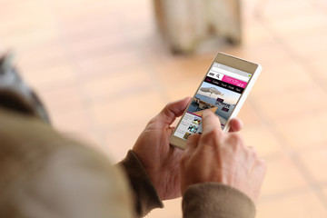 Brown young man smartphone trends blog