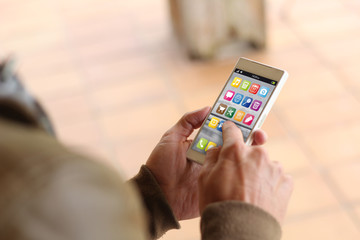 Brown young man using smartphone