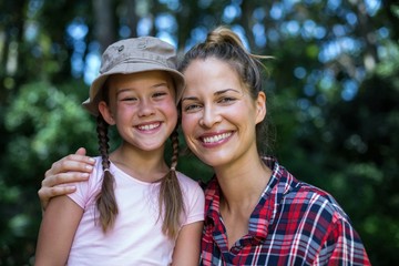 Fototapeta premium Portrait of cheerful mother with daughter