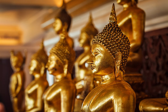 Golden Buddha statues in buddhist temple