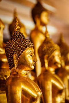 Golden Buddha statues in buddhist temple