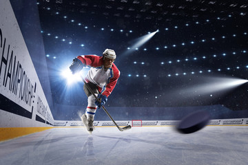 Ice hockey player on the ice arena