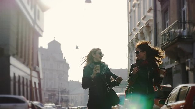 Two women walking in the city, steadicam shot