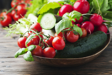 Mix of fresh vegetables on the wooden table