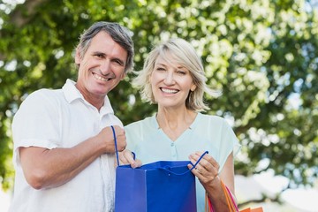 Portrait of couple with shopping bags