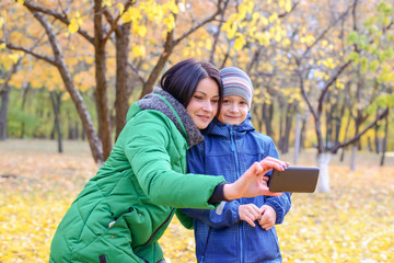 Woman and child looking at phone