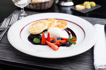 Syrniki with blueberry jam