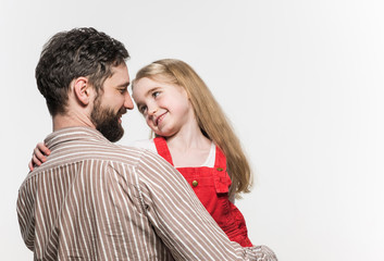 Girl hugging her father  over a white background