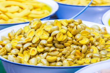 Thailand traditional pickled Madan fruit at the vintage float market.