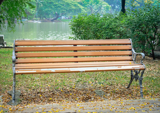 Old brown chair in city park, Bangkok, Thailand