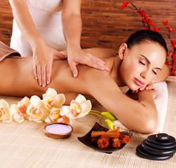 Obraz na płótnie Canvas Masseur doing massage on woman body in spa salon