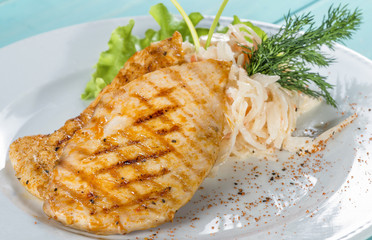Grilled chicken fillet serve fresh salad, cabbage and dill