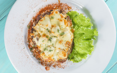 hot pork meat and cheese serve fresh salad