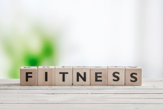 Fitness word on a wooden table