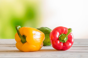 Colorful peppers on a wooden table