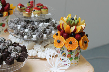 vase with fruit and sweets, candy bar