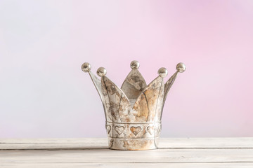 Royal crown on pink background