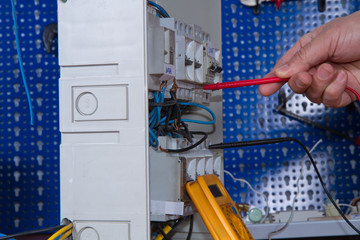 electrician at work with an appliance