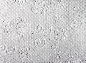 White toilet paper.Close-up view of ornamented toilet paper texture background.