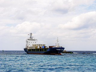 Cargo ship floats on water