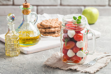 Caprese in a jar for lunch.