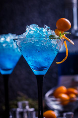 Blue cocktail in martini glasses