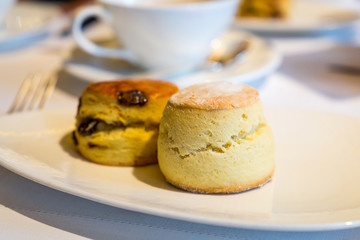 Small Rolls Served with a Cup of Hot Black Tea
