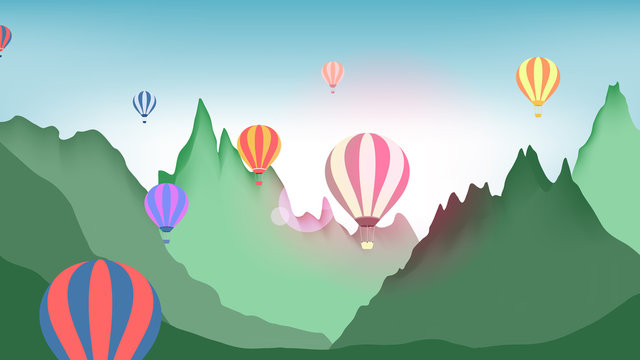 Hot air balloons flying over mountains