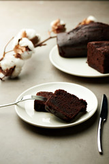 Tasty chocolate cake and cotton flowers