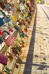 Fototapeta premium Locks that symbolize love.A pedestrian bridge.