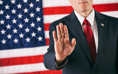 Politician: Man Holding Up Hand In Stop Pose