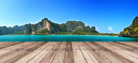 wood terrace against panorama Beautiful seascape in shining day © Pheniti