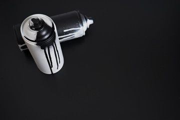 black and white spray paint bottle