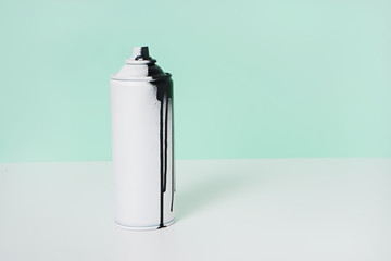 black and white spray paint bottle