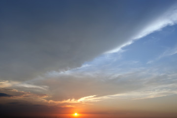 Naklejka na ściany i meble Evening sunset with cloudy skies
