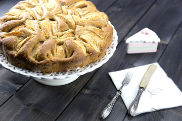 Traditional italian apple pie on a wooden table