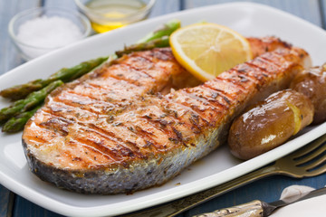 grilled salmon with potato on white dish
