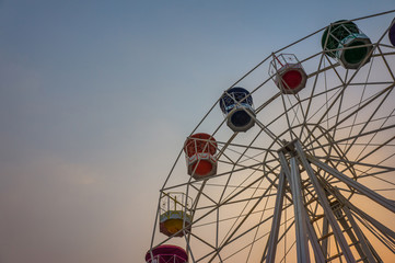 Ferris wheel on the background of sunset sky
