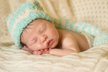 baby sleeps in a hat