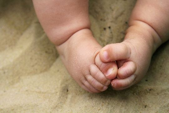 Baby Feet in Sand at Beach