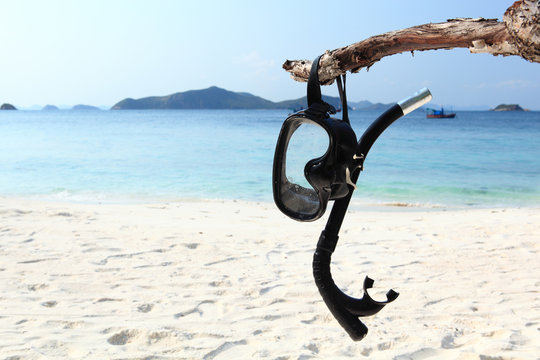 Vacation Start Here Concept, Scuba Diving Equipment or Snorkel gear  On The White Sea Sand Beach