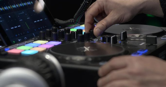 DJ Works With Digital Mixer