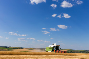 Combine harvester working on a wheat field.
